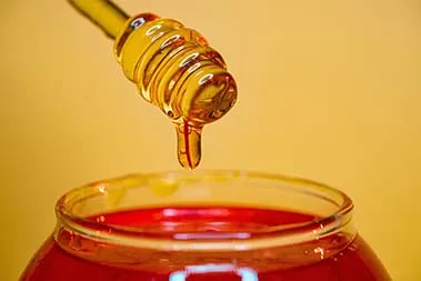 honey jars with dippers