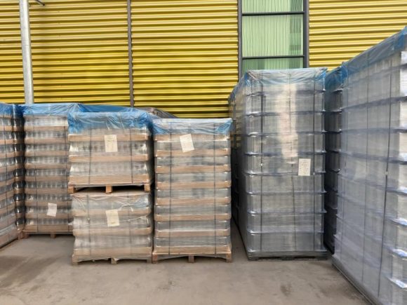 glass bottles on wooden pallets
