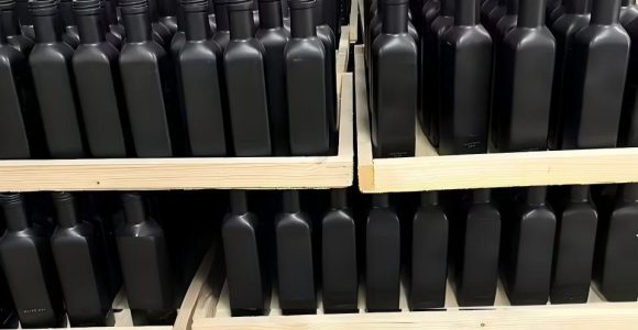 glass oil bottles on pallet