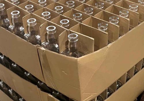 grid packaging for glass liquor bottles